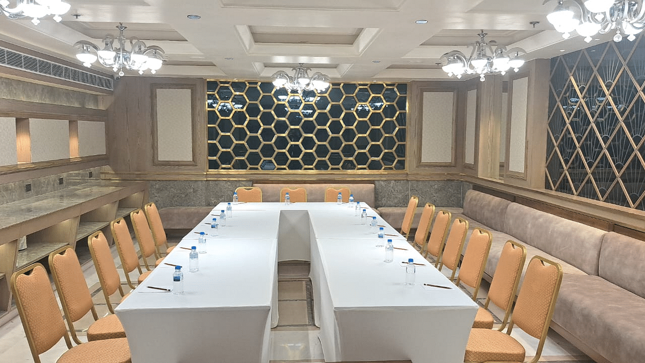 An event space with chairs arranged on both sides and tables placed in the middle at BluSalzz Residence, Amritsar